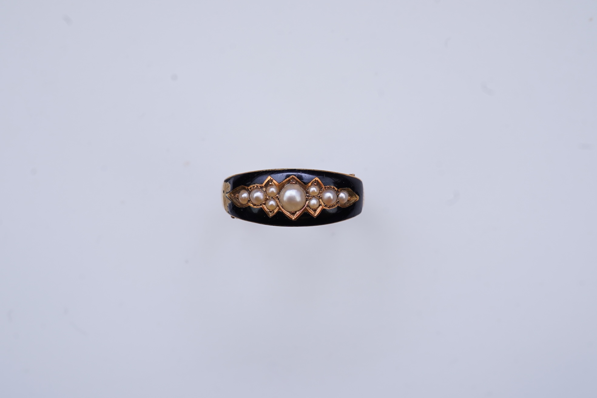 A Victorian black enamel and pearl mourning ring, 19th century